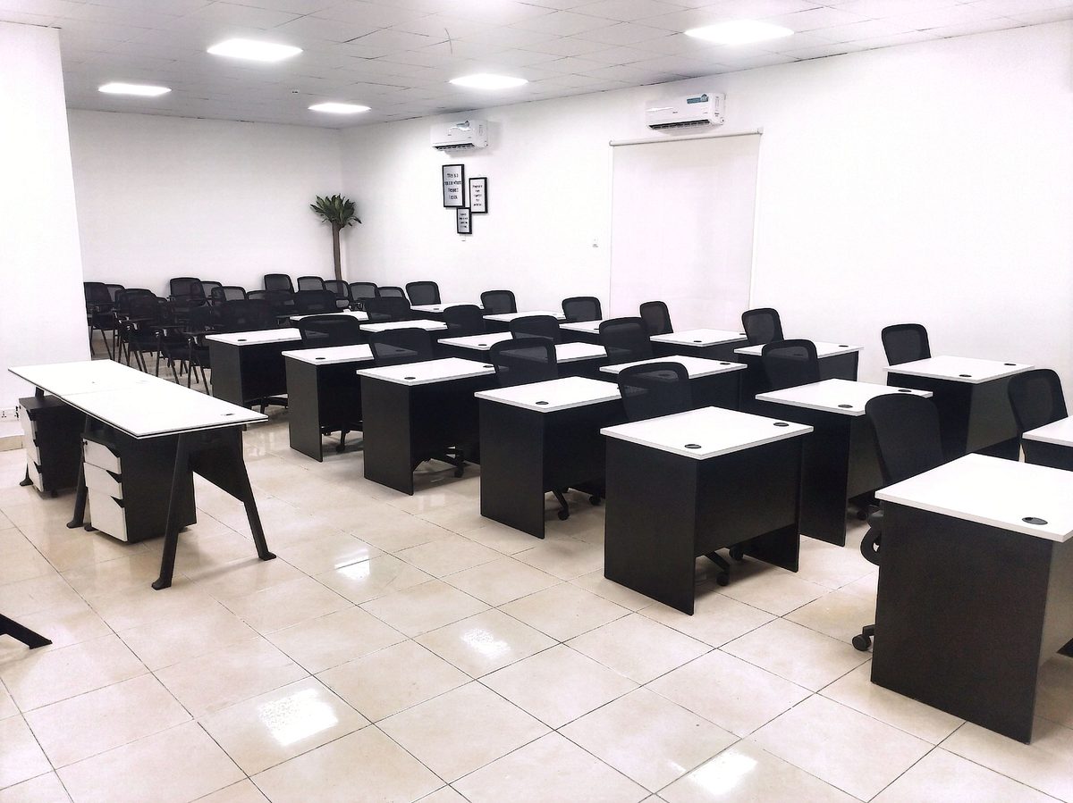 ABISL Training Centre Unit 1 — classroom with desks and seating